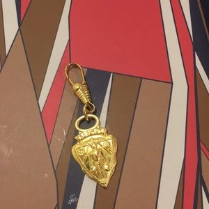 Gucci gold colored charm